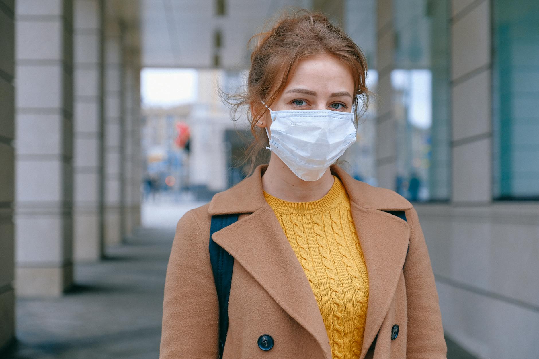 woman wearing face mask | Why Retail Stores Are Using Branded Face Masks