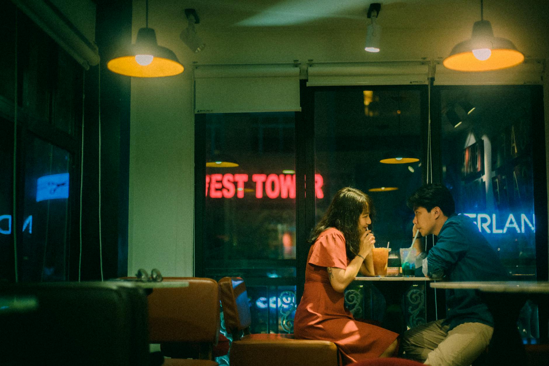 asian couple drinking cocktails in cafe at night | The Worst Date