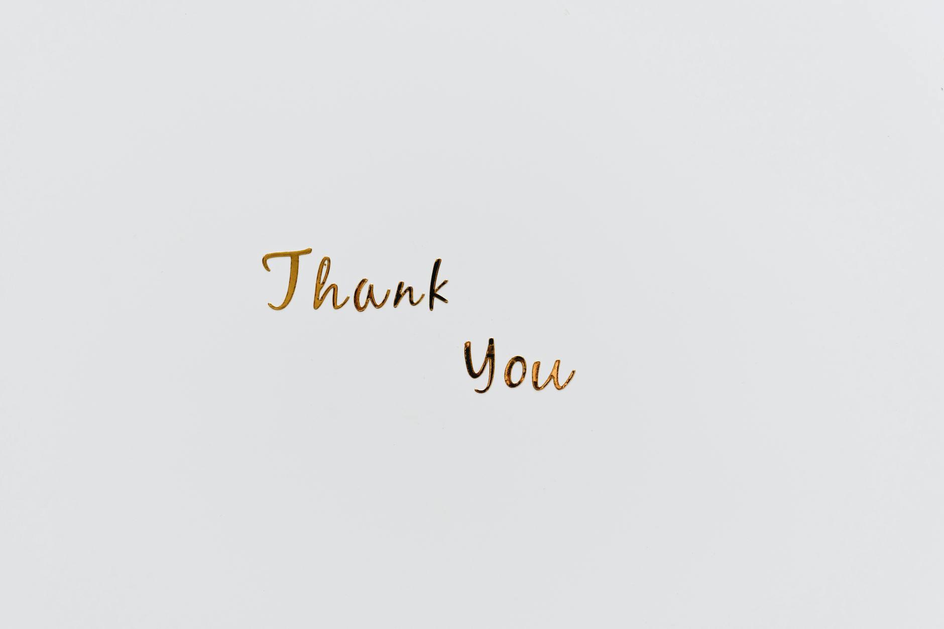 gold thank you text on a white surface | My Heart Is Filled With Gratitude